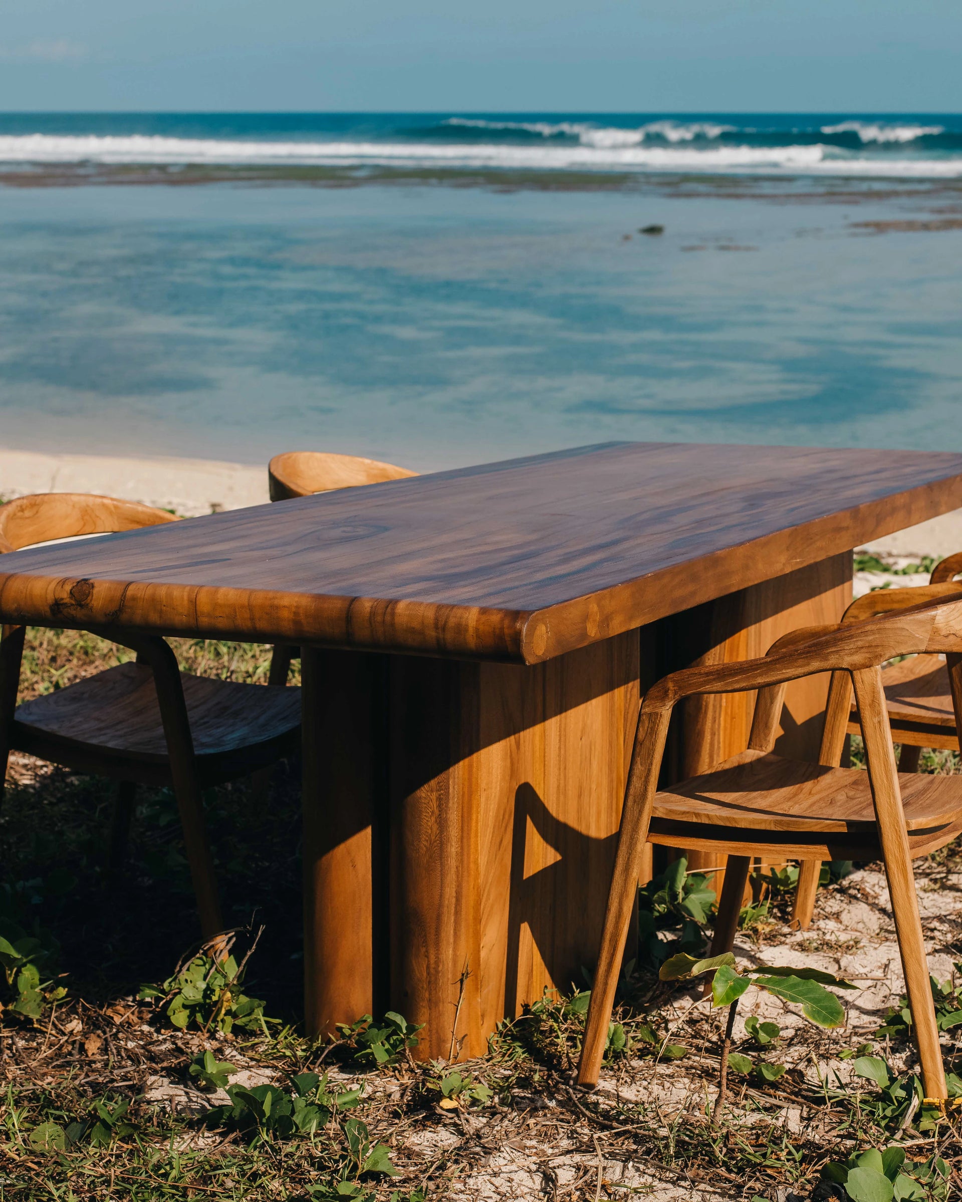 Beautiful suar dining table and dining chairs on the beach